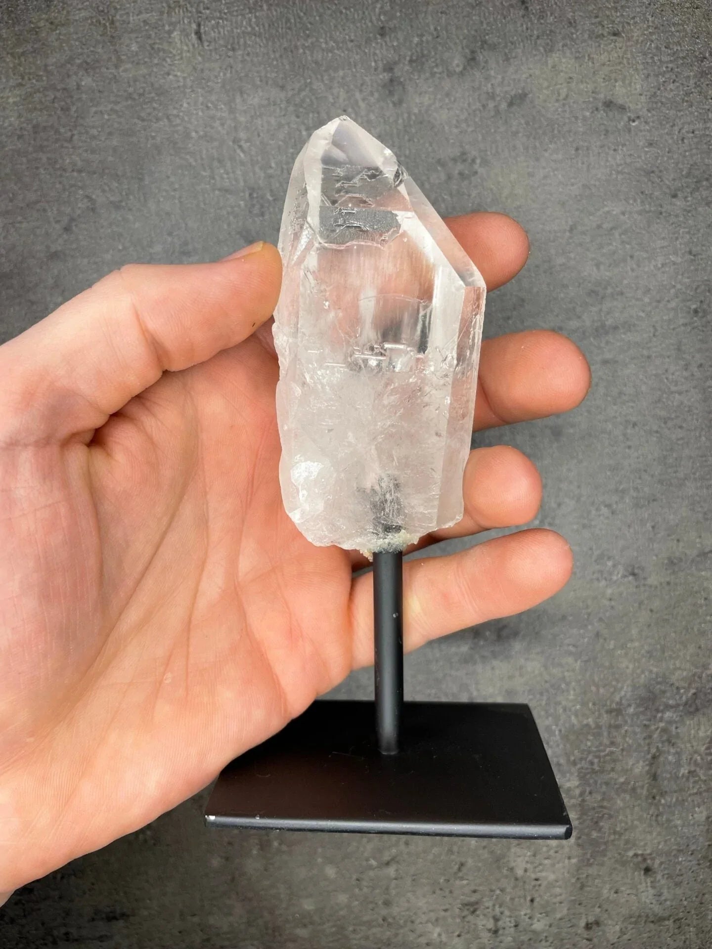 Clear quartz - Rough point on a stand